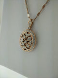 Diamond accented millgrain locket.