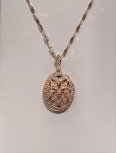 Diamond accented millgrain locket.