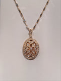 Diamond accented millgrain locket.